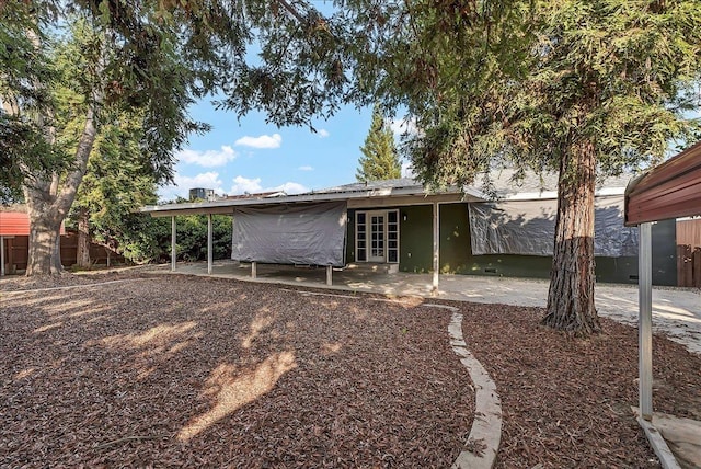 rear view of house featuring french doors and a patio