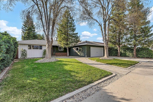 ranch-style house with a garage and a front lawn