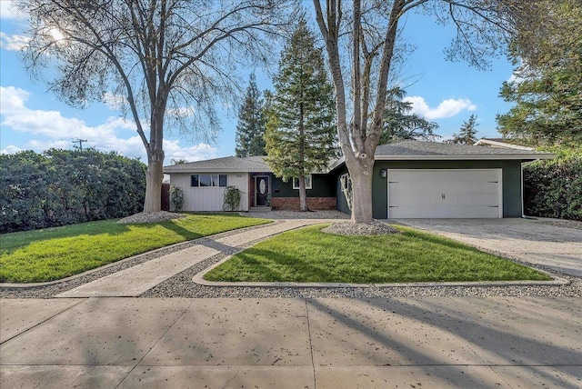 ranch-style house featuring a garage and a front lawn