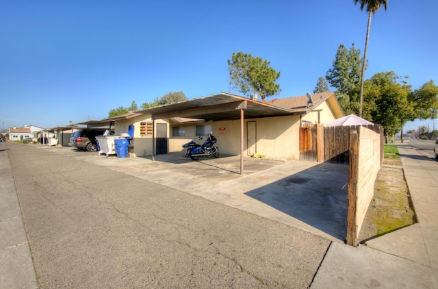 view of front facade with a carport