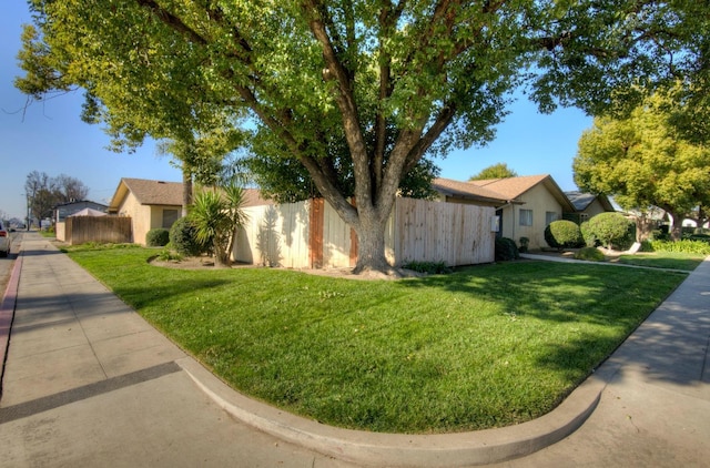 view of property exterior with a lawn