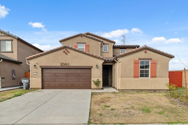 mediterranean / spanish-style home featuring a garage