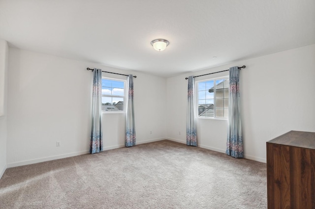 unfurnished room with carpet floors