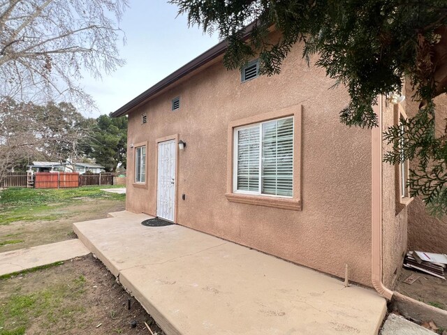 rear view of house featuring a patio area