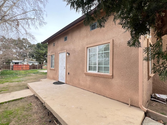 rear view of property featuring a patio