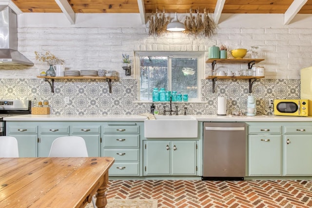 kitchen featuring wall chimney range hood, open shelves, stainless steel appliances, and a sink
