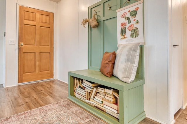 mudroom featuring baseboards and light wood-style floors