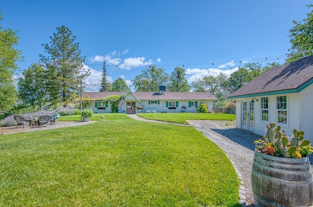 view of yard with french doors