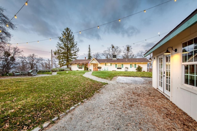 view of yard with french doors