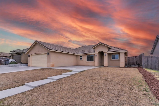 ranch-style house featuring a garage