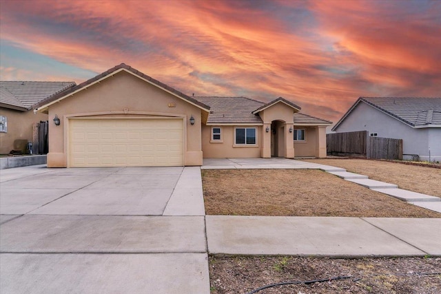 ranch-style house featuring a garage