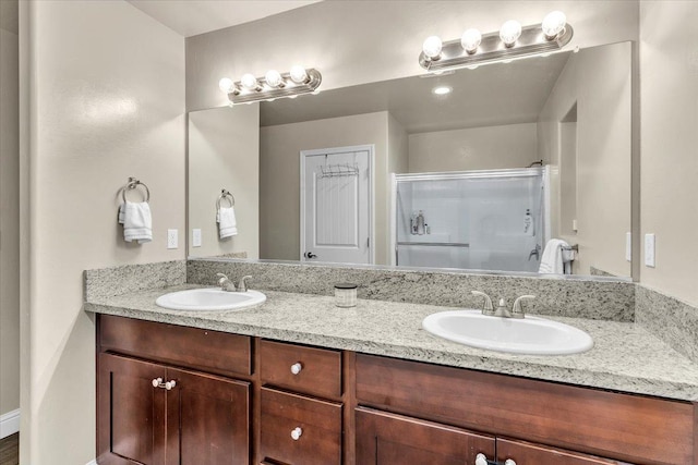 bathroom with vanity and an enclosed shower