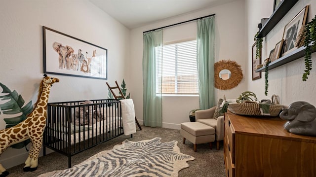 bedroom featuring carpet flooring and a crib