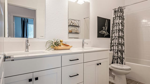 full bathroom with vanity, hardwood / wood-style flooring, toilet, and shower / bathtub combination with curtain