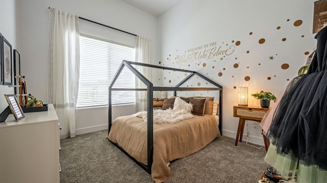 bedroom featuring baseboards and light colored carpet