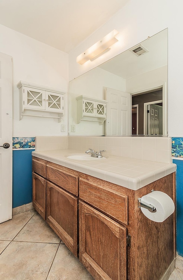 bathroom featuring vanity and tile patterned flooring