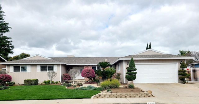 1855 Dennis Ave, Clovis, CA 93611 - single story home featuring a front yard, an attached garage, a shingled roof, and driveway