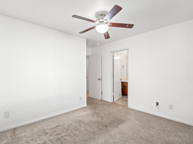 unfurnished room featuring ceiling fan and light colored carpet