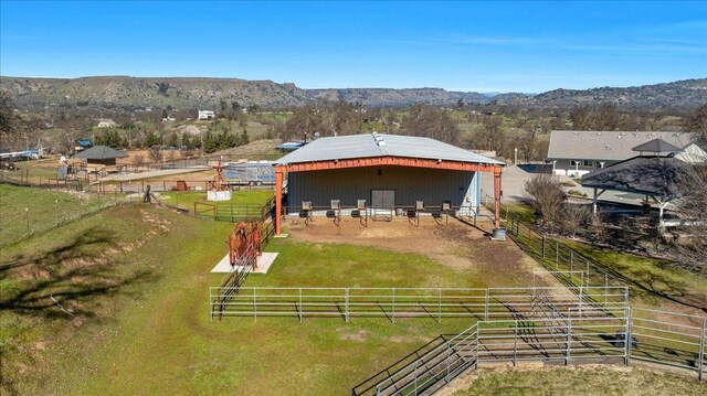 birds eye view of property featuring a rural view and a mountain view