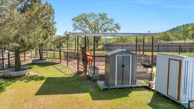exterior space featuring an exterior structure, an outbuilding, and a storage unit