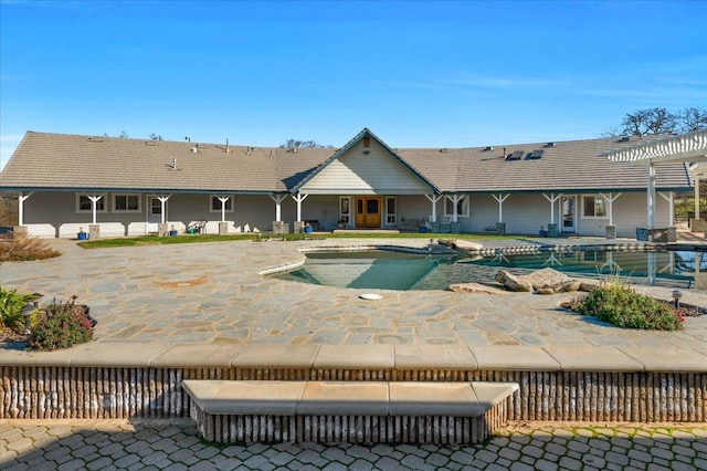outdoor pool featuring a patio