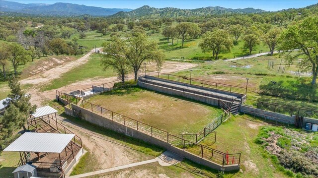 birds eye view of property featuring a mountain view and a rural view