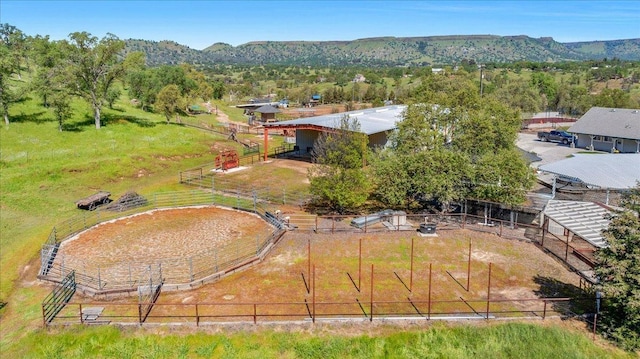 drone / aerial view with a mountain view and a rural view