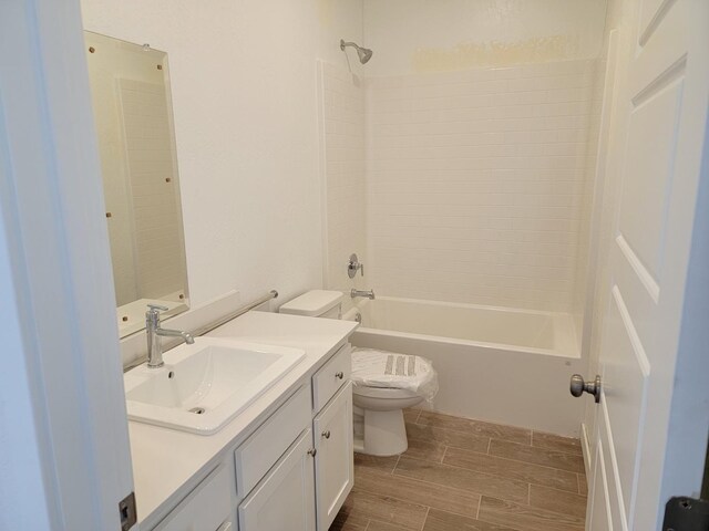 full bathroom featuring vanity, toilet, and tub / shower combination