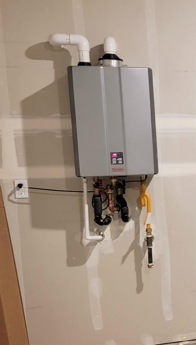 utility room with water heater