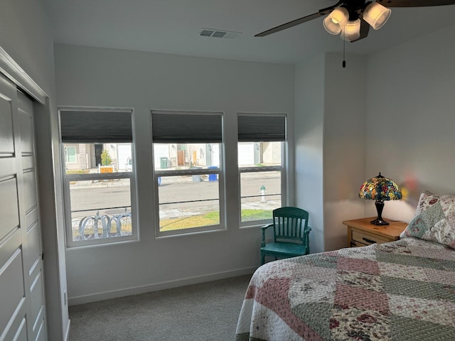 carpeted bedroom featuring ceiling fan