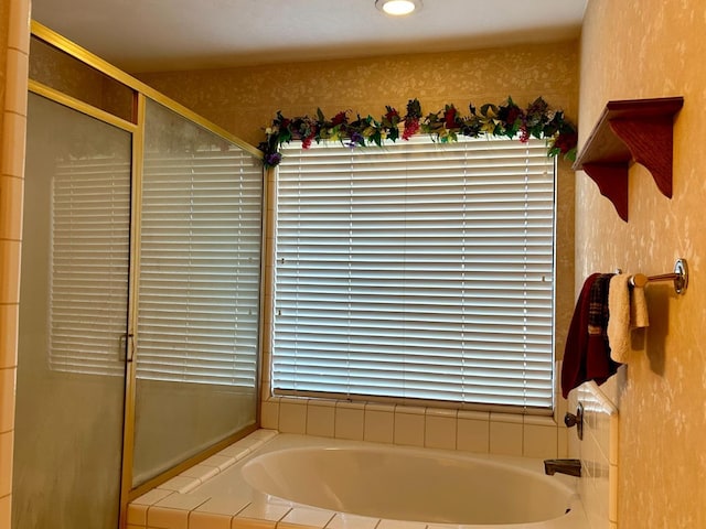 bathroom featuring plus walk in shower