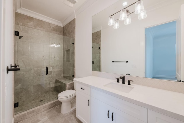 bathroom featuring vanity, crown molding, a shower with shower door, and toilet