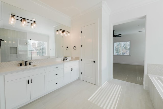 bathroom with crown molding, ceiling fan, vanity, and shower with separate bathtub