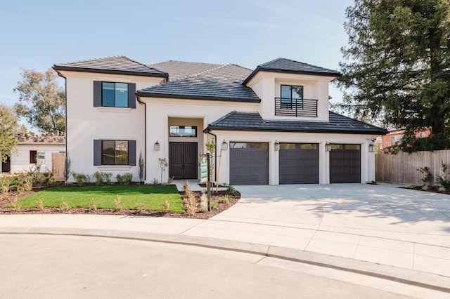 view of front of home with a garage and a front lawn