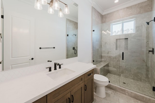 bathroom with vanity, a shower with door, ornamental molding, and toilet