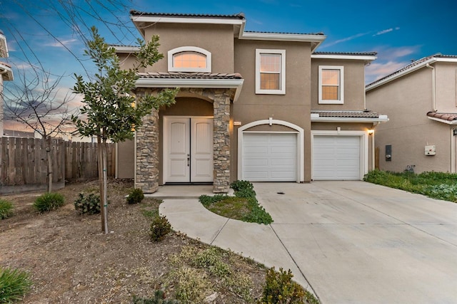 mediterranean / spanish-style home featuring a garage