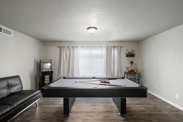 recreation room with visible vents, a textured ceiling, pool table, and wood finished floors