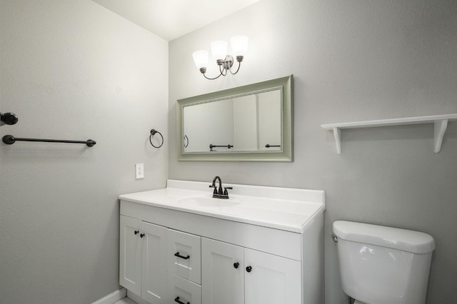 bathroom featuring toilet and vanity
