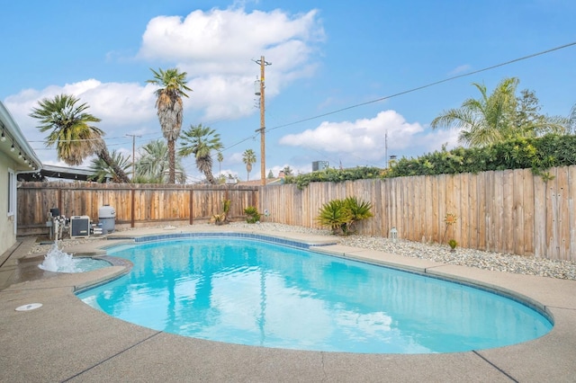 view of pool with a fenced in pool, a fenced backyard, and a patio area