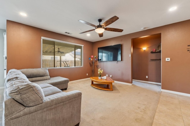 living room featuring ceiling fan and light colored carpet