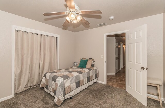 16526 Paula Rd, Madera, CA 93636 - carpeted bedroom featuring visible vents, baseboards, and a ceiling fan