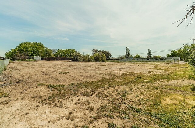 16526 Paula Rd, Madera, CA 93636 - view of yard with an outbuilding, fence, and a storage unit
