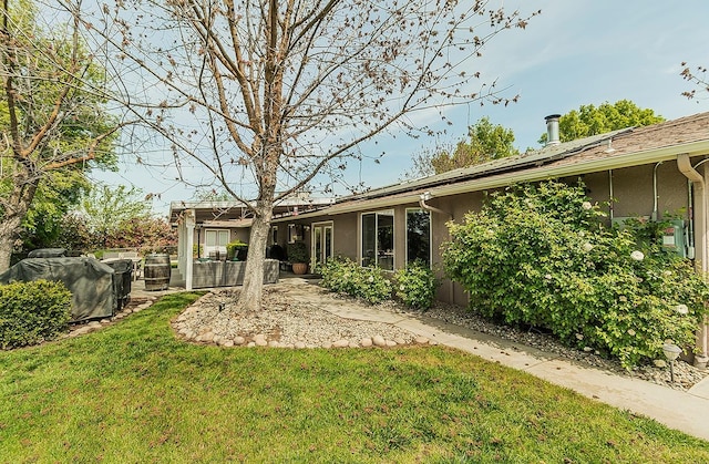 16526 Paula Rd, Madera, CA 93636 - rear view of property featuring a yard, a patio, and stucco siding