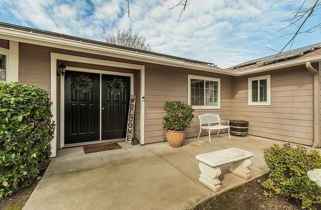 16526 Paula Rd, Madera, CA 93636 - doorway to property featuring roof mounted solar panels