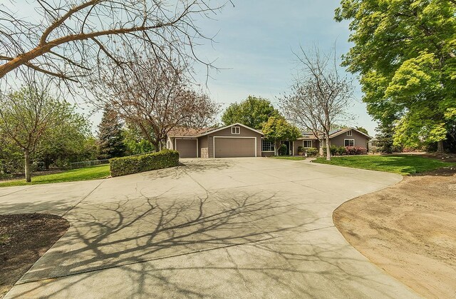 16526 Paula Rd, Madera, CA 93636 - view of front of house with a front lawn, an attached garage, and driveway