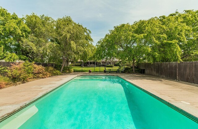 16526 Paula Rd, Madera, CA 93636 - view of swimming pool with a fenced backyard and a lawn