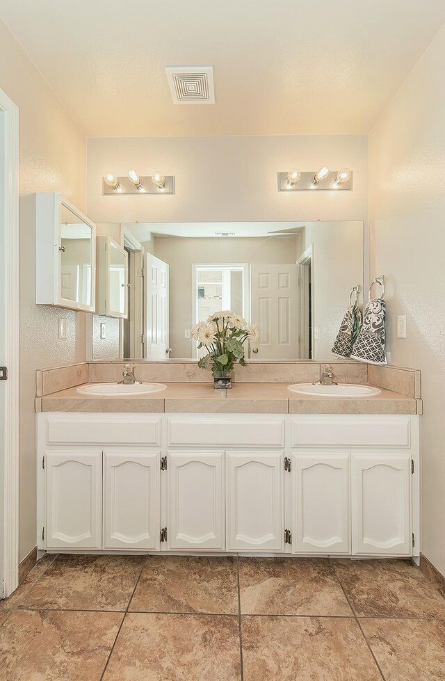 16526 Paula Rd, Madera, CA 93636 - bathroom featuring a sink, visible vents, and double vanity