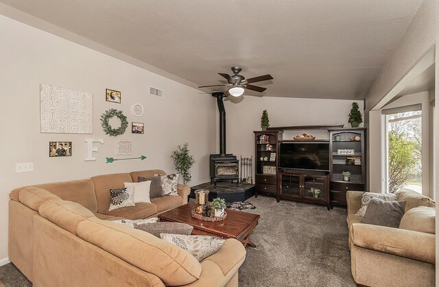16526 Paula Rd, Madera, CA 93636 - living area featuring a wood stove, ceiling fan, carpet, and visible vents