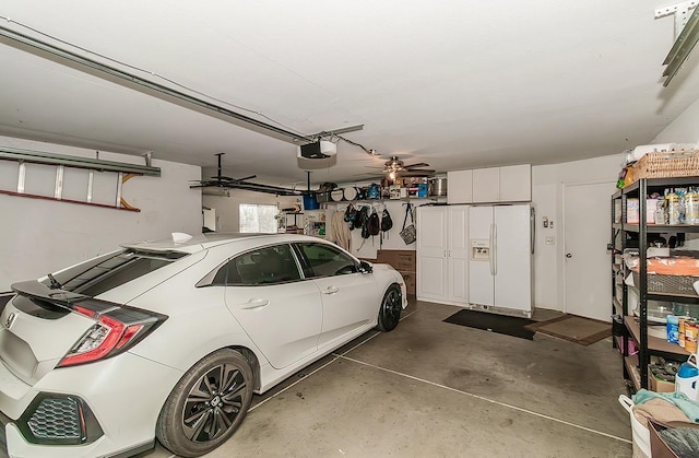 16526 Paula Rd, Madera, CA 93636 - garage with white refrigerator with ice dispenser, a garage door opener, and a ceiling fan