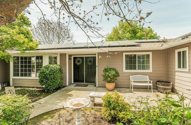 16526 Paula Rd, Madera, CA 93636 - property entrance with a patio area and solar panels